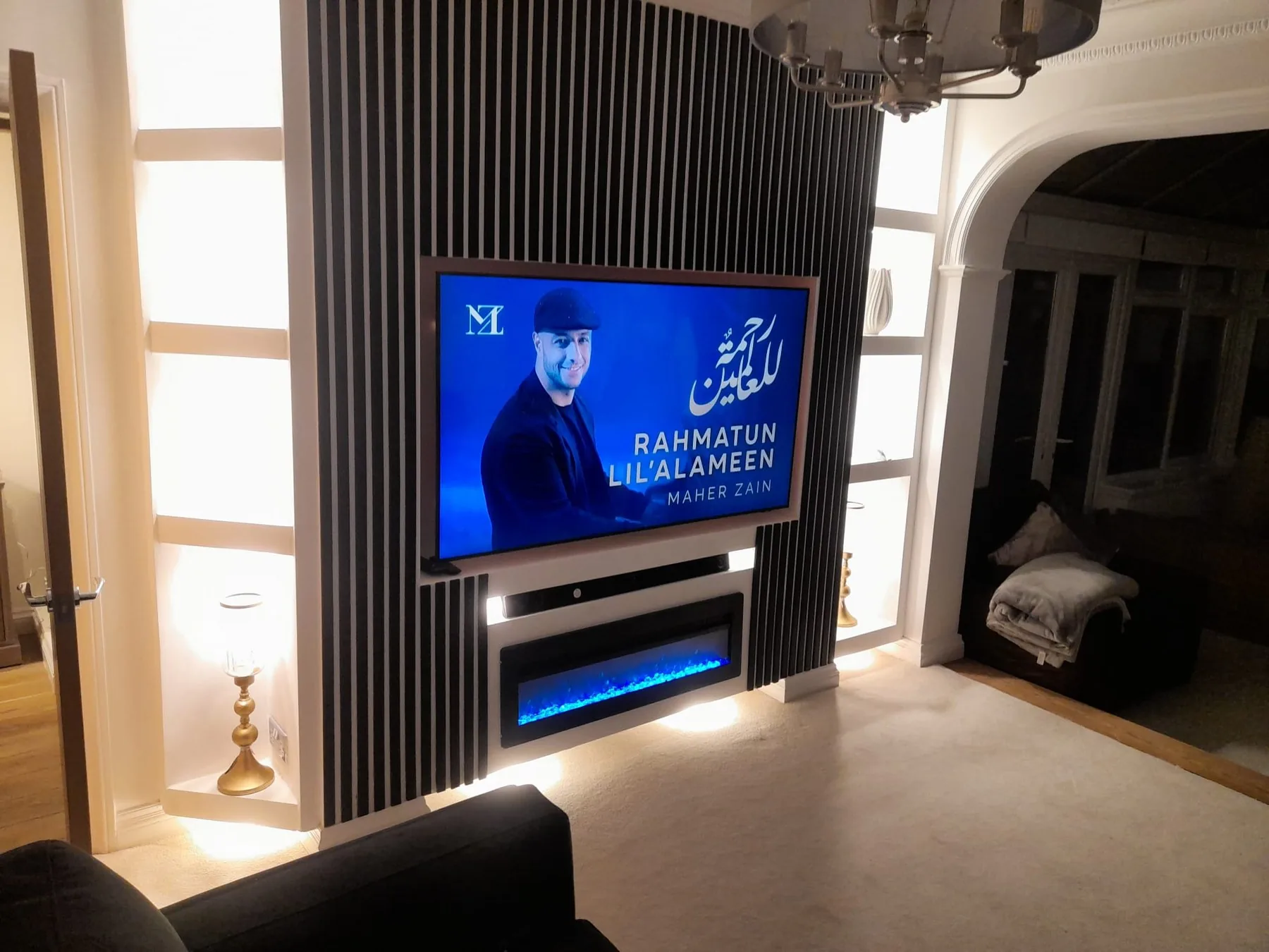 Completed slatted media wall with television and electric fire by Campbell and Sons