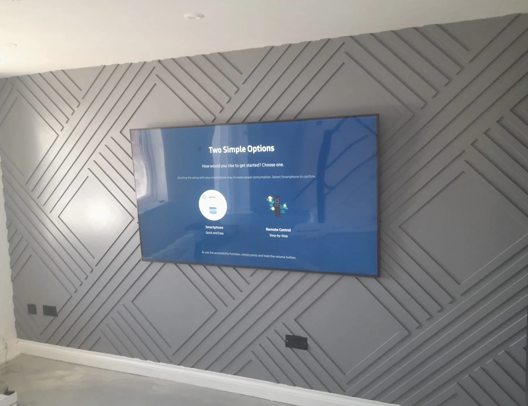 Completed geometric television feature wall by Campbell and Sons