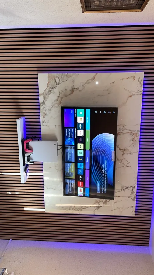 Slatted media wall with television and lighting